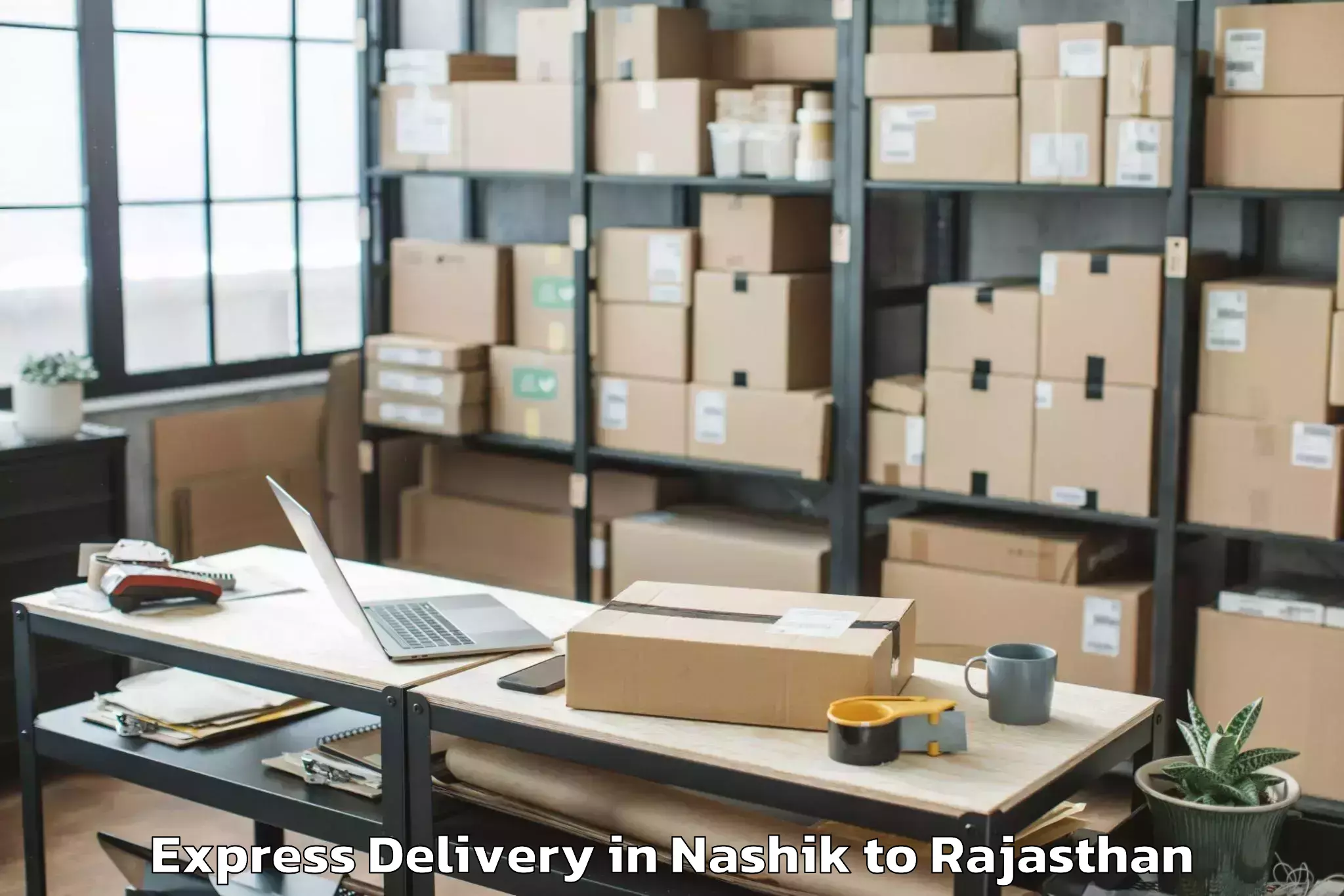 Nashik to Lakheri Express Delivery